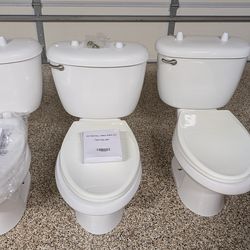 Three used standard height toilets, for free