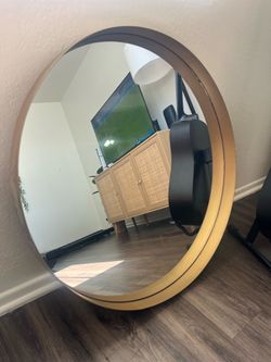 Gold round mirror