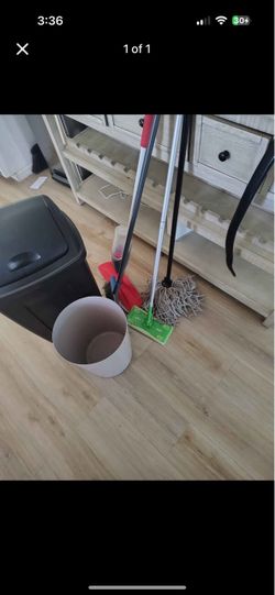 Trash can, brooms, and mops