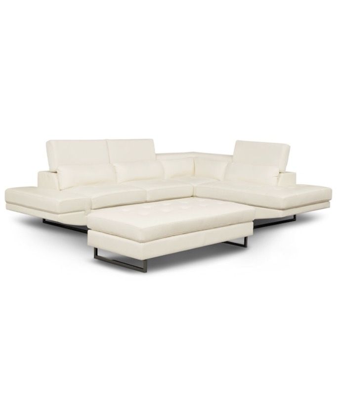 White leather sectional, there is some wear and tear on the arm of the couch as well as the ottoman