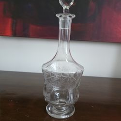 Crystal decanter with etched grapevine design and faceted stopper