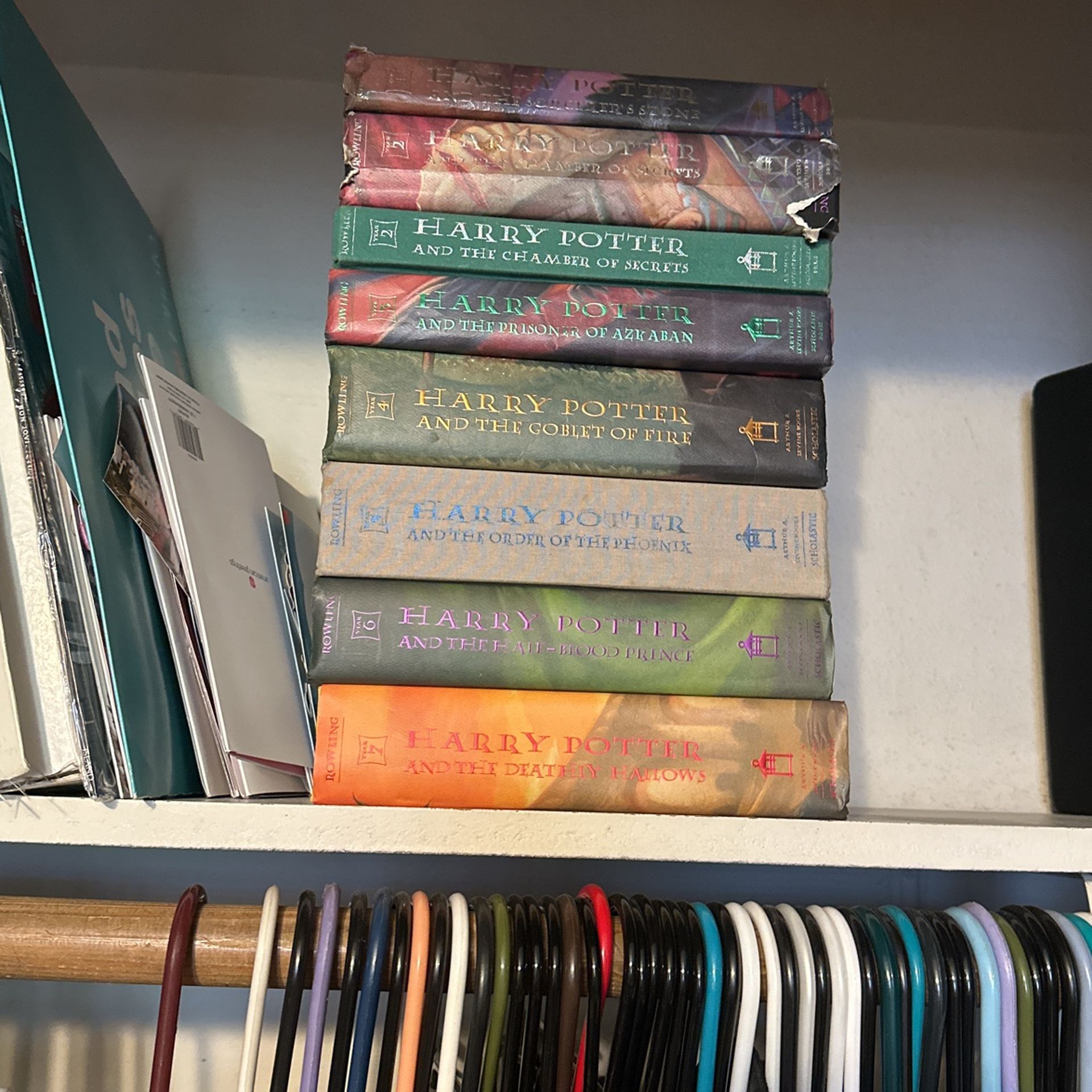 Hard back seven books series of Harry Potter and Dumbledore’s wand