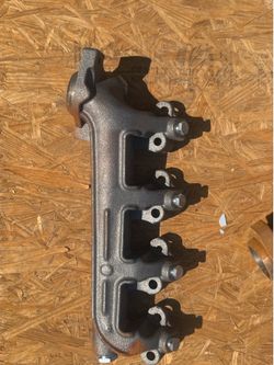 OEM Cast Iron 4-Cylinder Exhaust Manifold – Factory Original