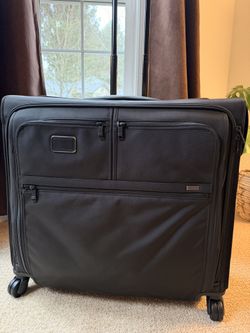 NEW Tumi 4 Wheeled Black Suitcase