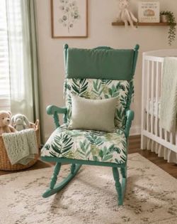 Green gender nuetral rocking chair with cushions.