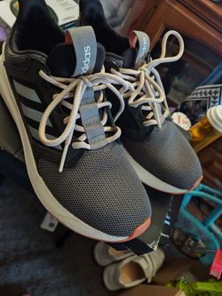 She's a used pair of Adidas athletic shoes in very good condition, size 8½.