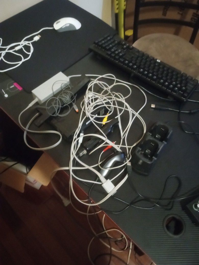Nintendo Wii with All Cords And Nintendo Wiimote And Nunchuk With Rechargeable Battery And Charger Port Using A Usb-A Cable.