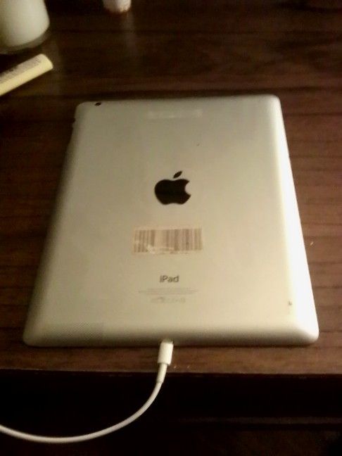 iPad Apple Tablet Couple Of Cracks On The Screen But Not Noticeable Just Needs To Be Loaded To The Wi-Fi It's Unlocked