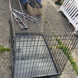 Dog Crate Size Length 42 Double Door, Collapsible. Price 45$. Pick Up.  E.   72nd. and Grand View.   E.   Tacoma 
