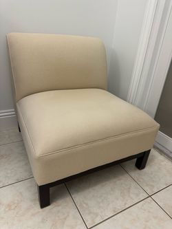 Two matching Crate and Barrel single sofa’s chairs