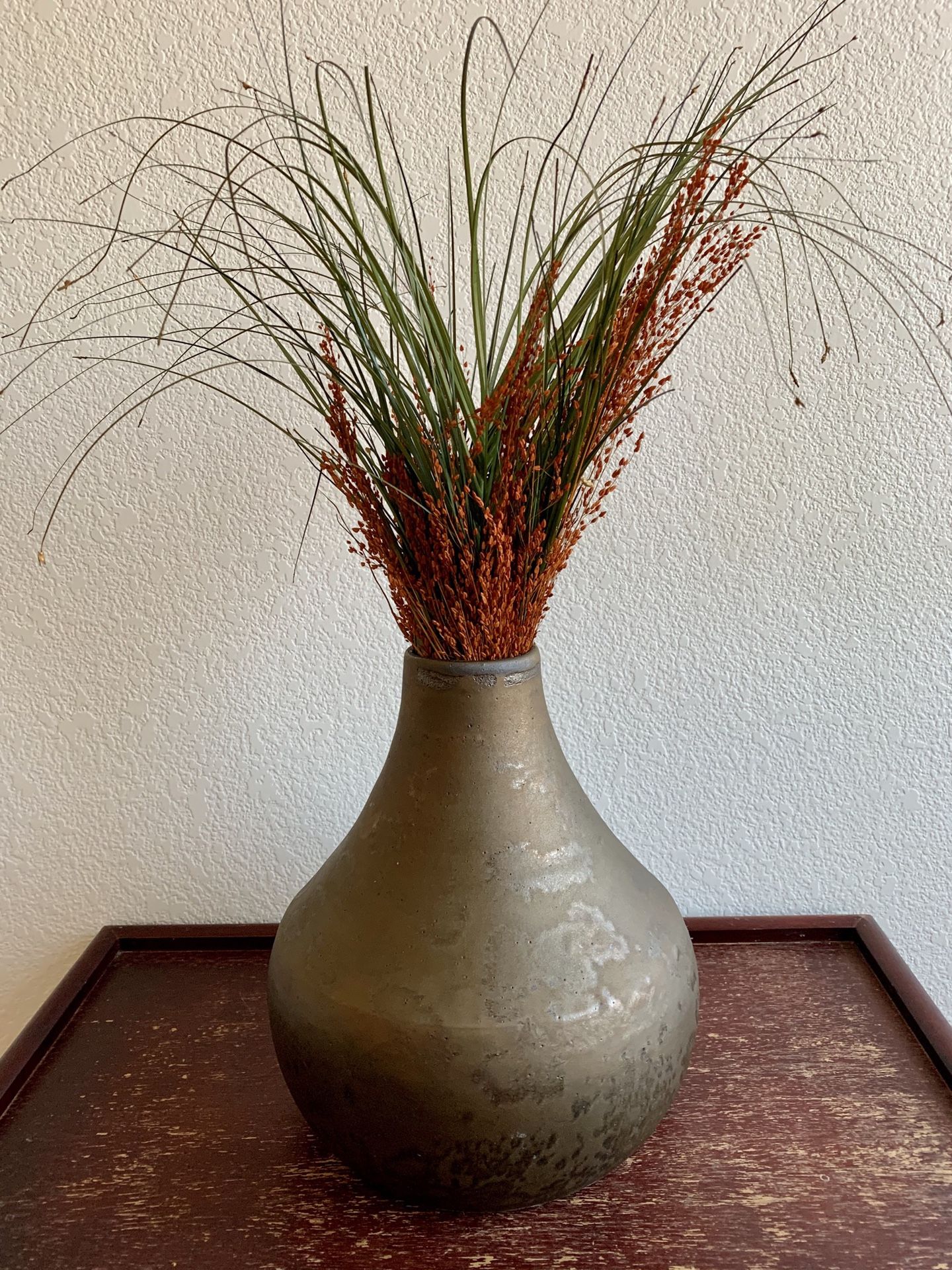 Pottery boho vase with dried flower