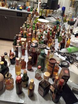 Collectable miniature bottles some full some half full