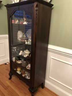Antique China / Curio Cabinet Dark Wood. 38 inches wide by 58 inches tall by 14 inches deep. 5 Shelves. 4 Shelves are Movable