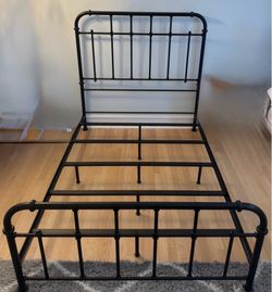 Full size black metal panel bed frame with spindles