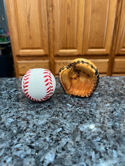 Ceramic Glove and Baseball pair of Salt and Pepper Shakers.  Size approximately  2 1/2 inches tall.  Brand new never used.  Brand Clay Art.  Has been 
