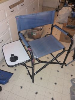 navy blue folding director's chair features a sturdy steel frame, a built-in folding side table with a cup holder, and a 250 lbs weight capacity