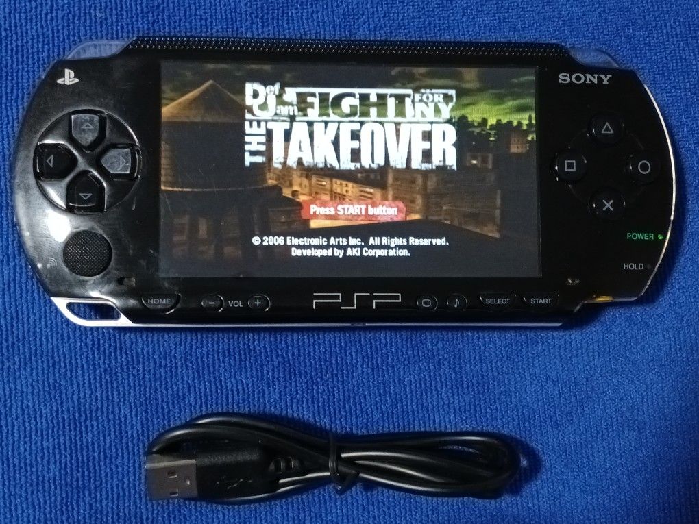 PSP With Charger And Games Inside