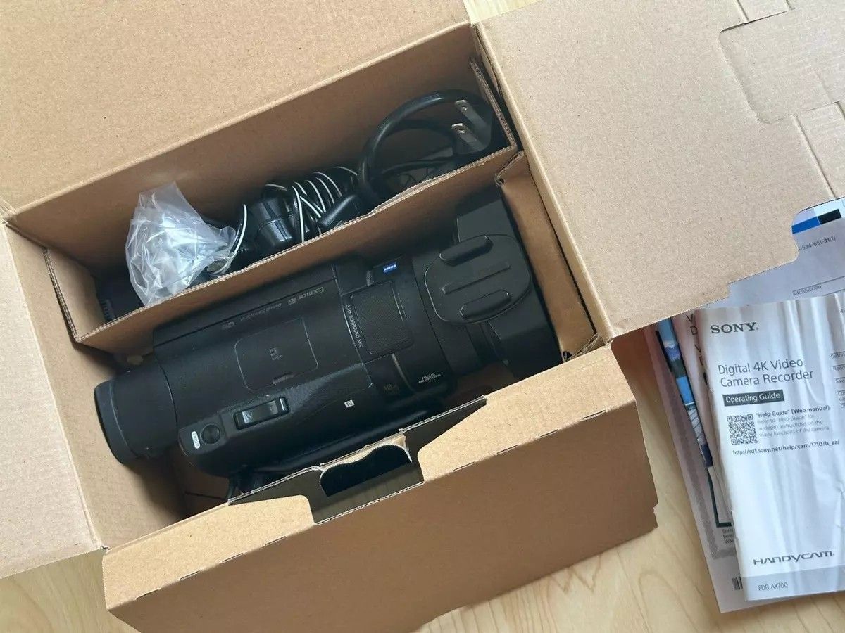 Sony FDR-AX100 4K Camcorder w/3 Batteries, Remote, 64GB Memory Card, power cord