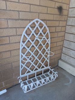 Wrought Iron wall mounted Trellis planter with an attached basket and ring holders decorative