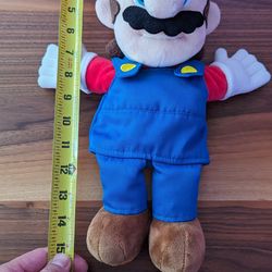 SUPER NINTENDO WORLD Medium Mario Plush $30