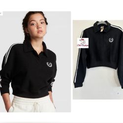 PINK REVERSE FLEECE CROPPED POLO SWEATSHIRT Medium  The Takeaway: Puts some prep in your step Sporty stripes and a cropped silhouette kick this classi