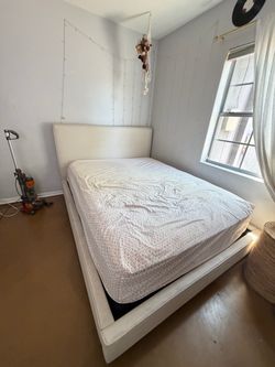 Dean Sand Living Spaces Upholstered Queen Bed Frame