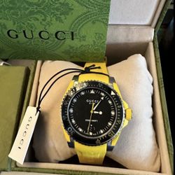 GUCCI Diver 136.3 Black Dial Yellow Rubber Strap Man’s Watch Ref. YA136319   New never worn comes with tags box and papers  This one retails over $1,2