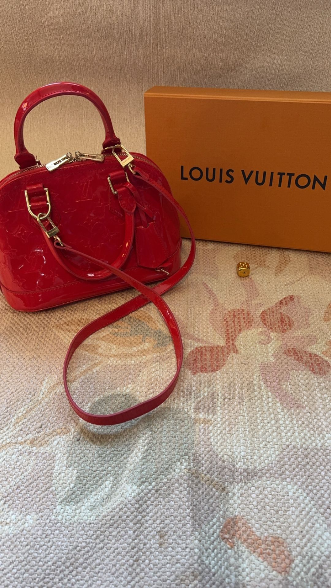 Red Louis Vuitton handbag