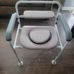 Adjustable medical bedside commode chair,