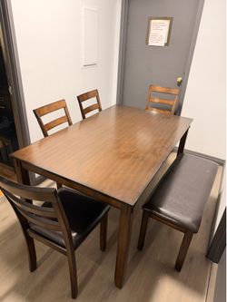 Table with 4 chairs and stool