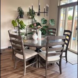 Round dining table with 6 chairs