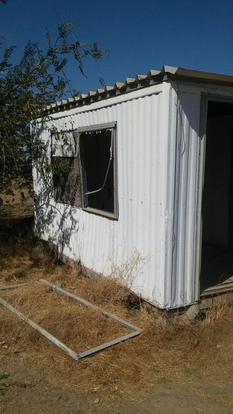 Abandon shed. Its yours free if you can move it!