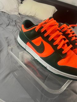 Their size 13 orange and green
