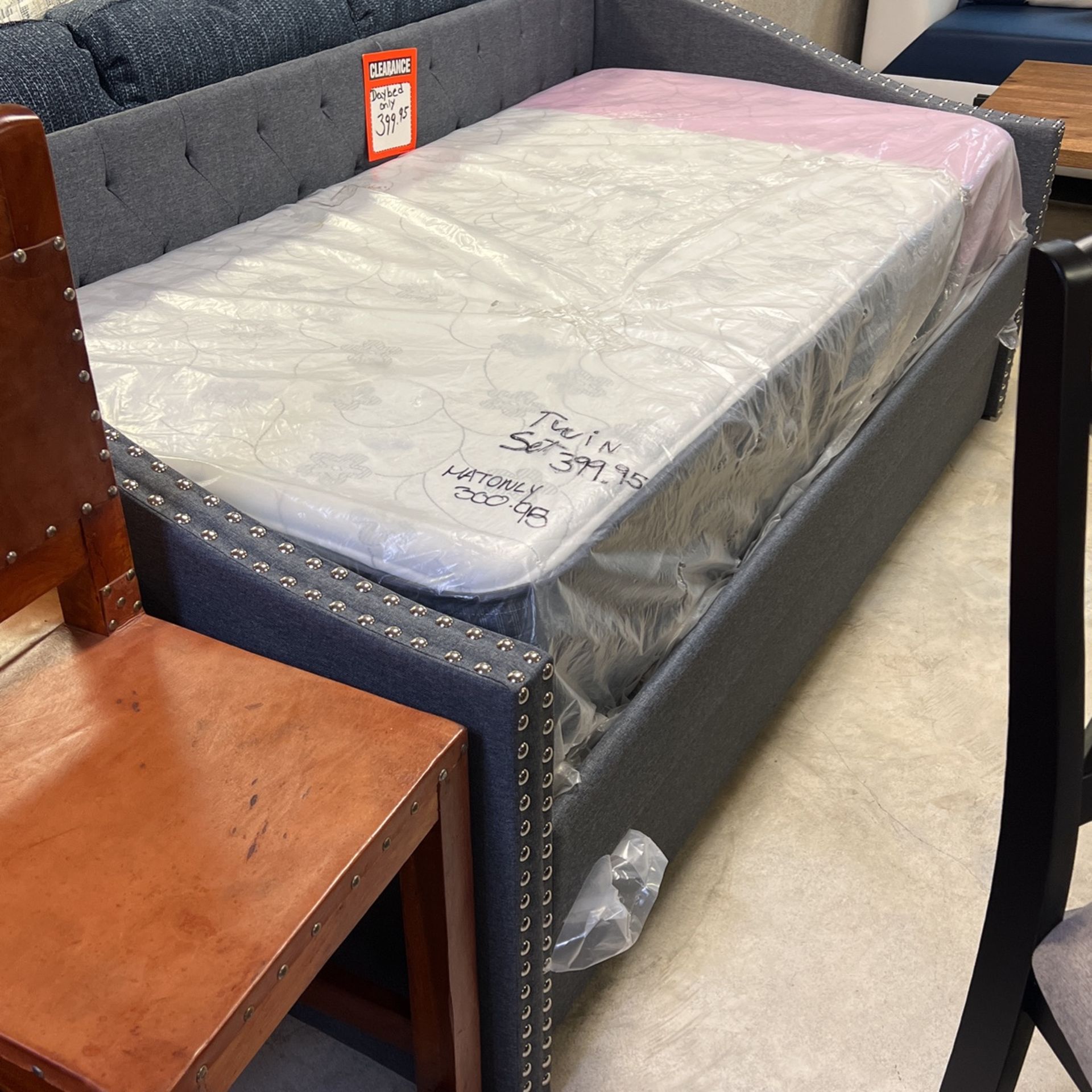 Brand new gray cloth daybed 399 mattresses start as low as 89 each each