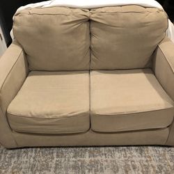 Light brown/tan love seat, 55”W 23”, pull out bed is 72”x32”