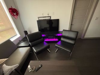2 black leather chairs -$75 Each / $120 both