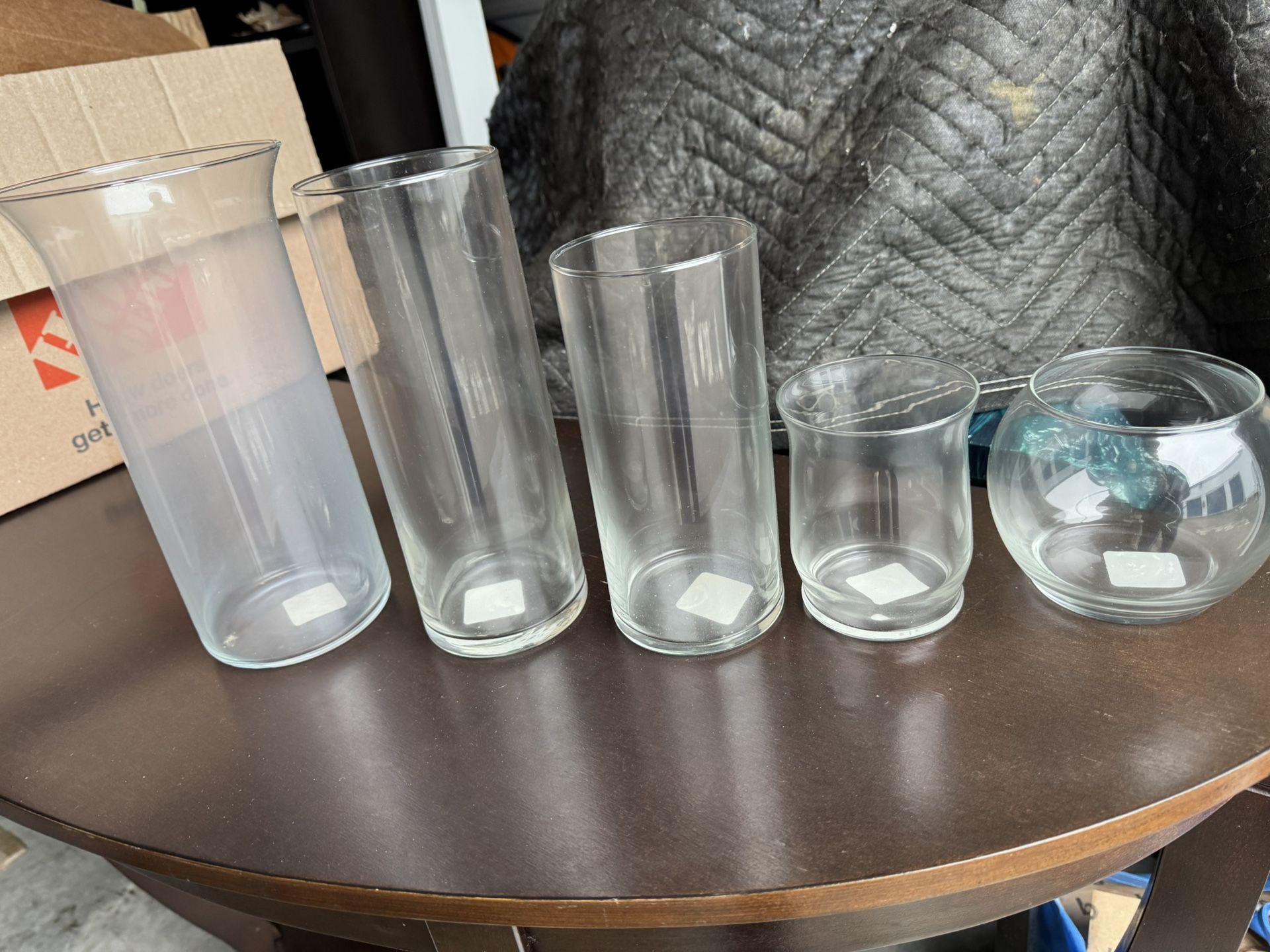 An Assortment of Clear Glass Vases . Can Be Used For Centerpieces At Wedding , Graduation, Any Occasion. 120 Of Each Vase Available @ $3 Dollars Each