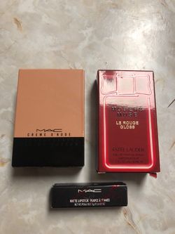 Two perfumes and lipstick