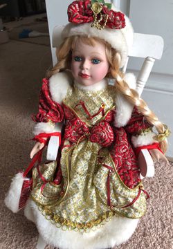 Classic beautiful Mrs. clause Porcelain doll in her rocking chair