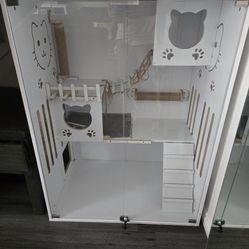 Large wooden indoor cat villa with alass doors, wheels ventilation, and space for two cats.