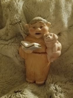 Padre holding a pig /statue 7inches high with 2 piggy friends at his feet