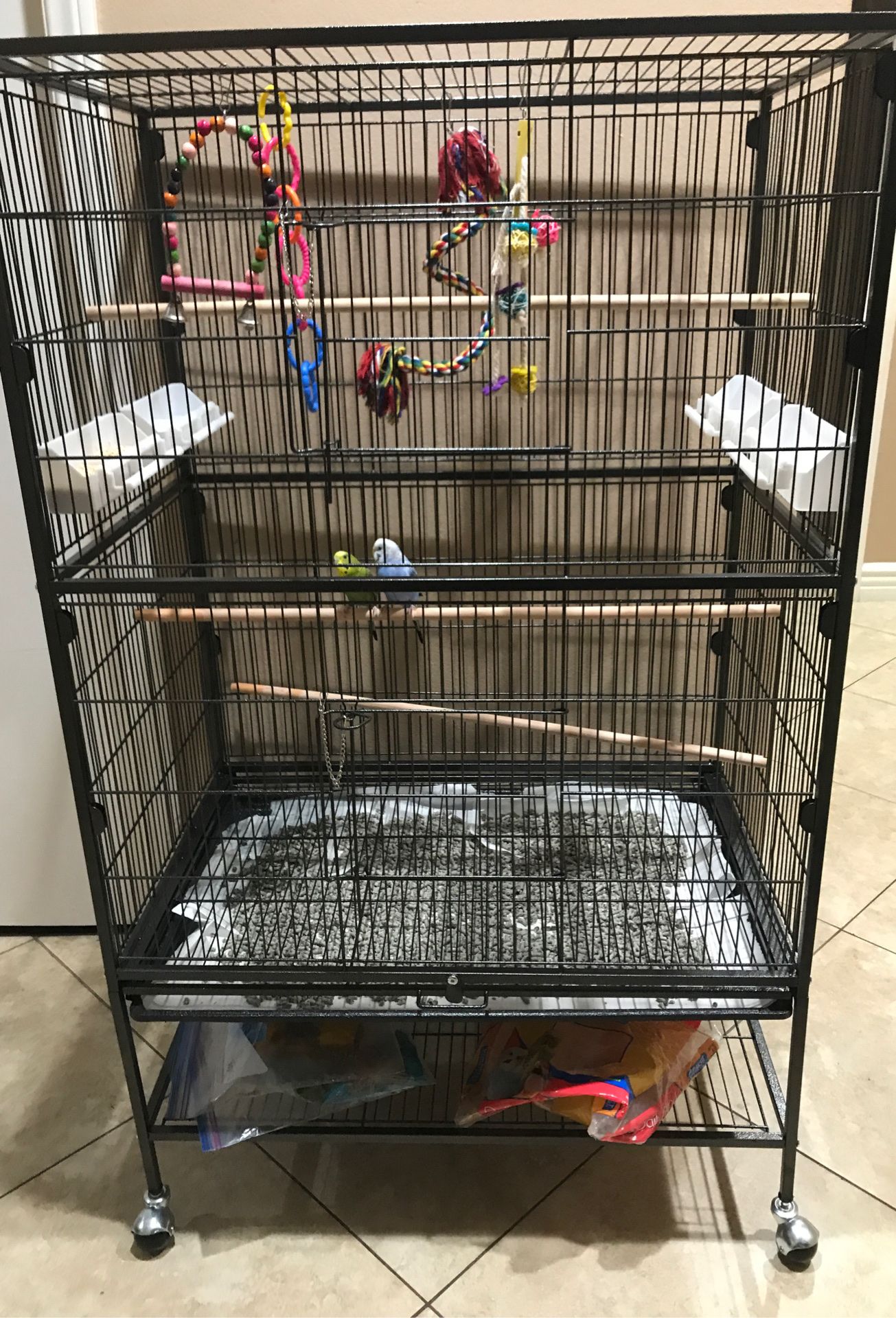 $$160 obo Brand NEW cage too big for only 2 parakeets comes with wheels to doors and 4 feeding trays