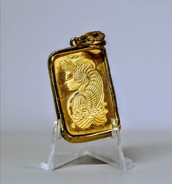 Pamp 10 grams gold bar pendant w/ 14k gold bezel come with original assay- cash & local pickup at angleton only