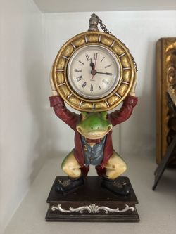 Whimsical butler frog holding pocket watch