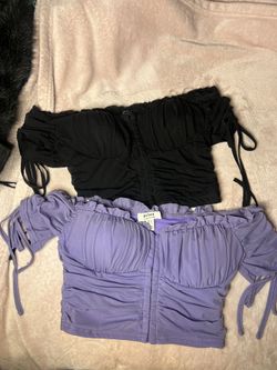 purple and black cropped shirts