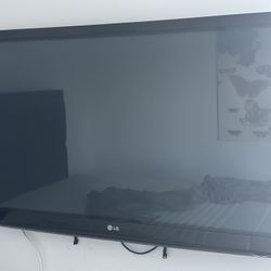 LG TV 48” Smart Tv w/ Floor Stand And Wall Mount. 
