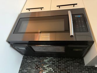 For parts or repairs: Samsung ME18H704SFG Over-the-Range Microwave 1.8 Black Stainless Steel
