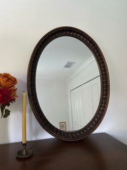oval bronze wall mirror