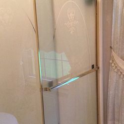 Gold sliding glass shower stall doors