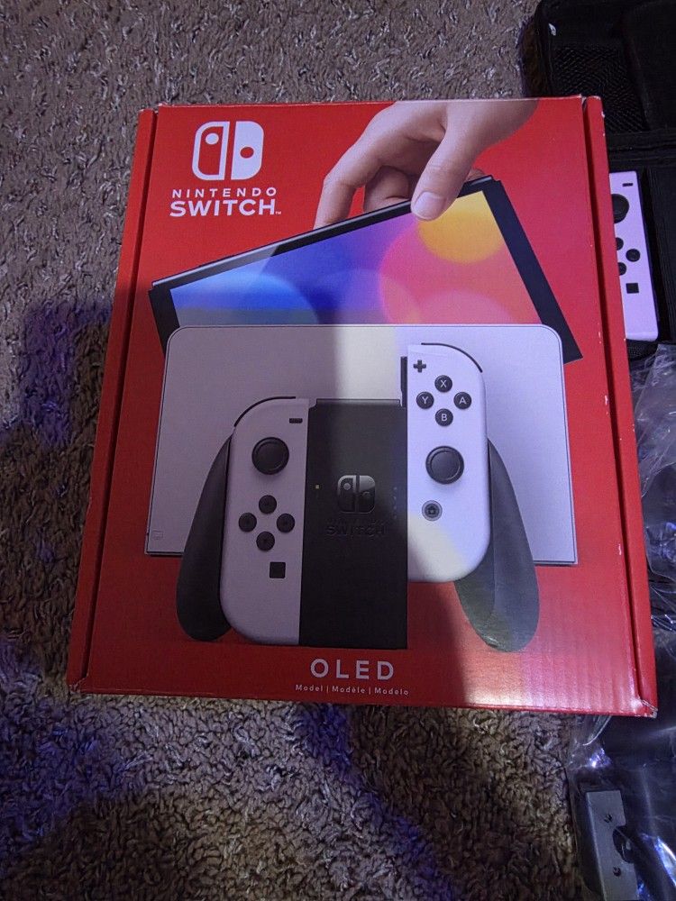 oled switch used once or 2wice literally new not a scratch on anything full docking station